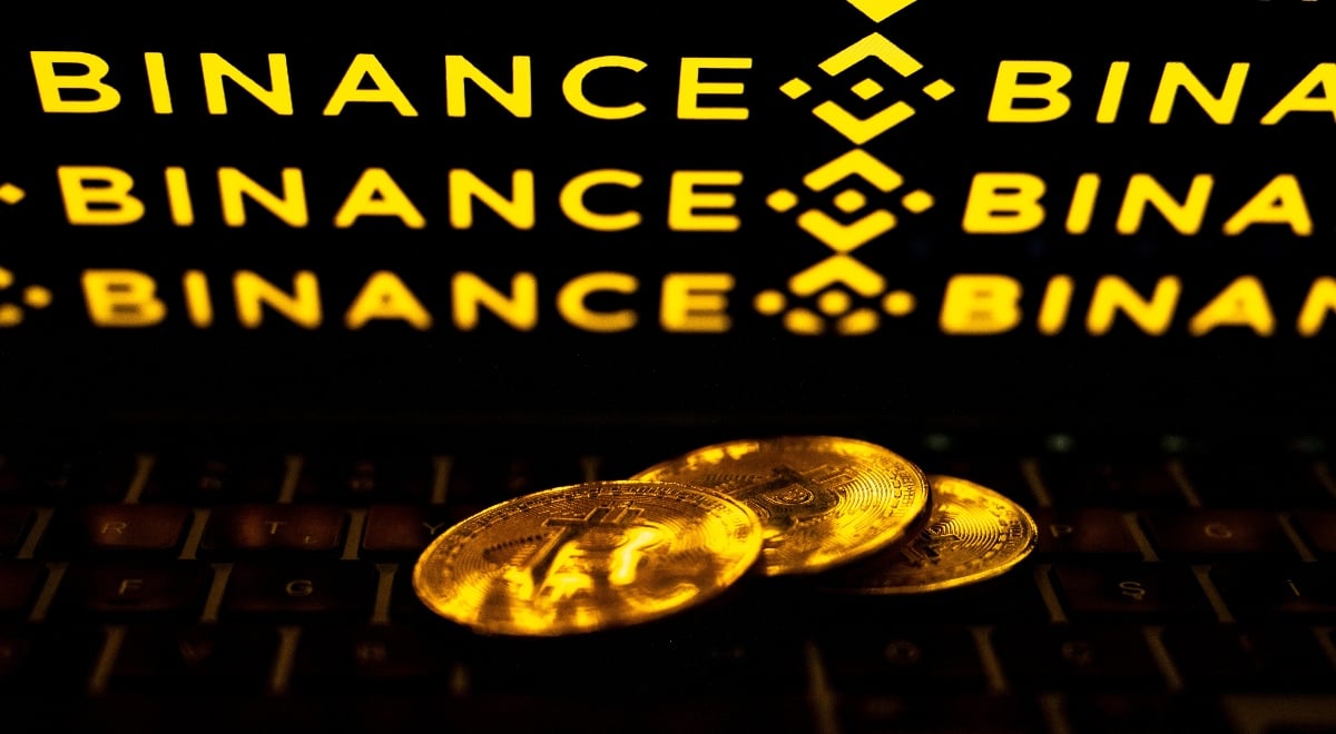 Bitcoin coins with Bitcoin crypto exchange logo in the background