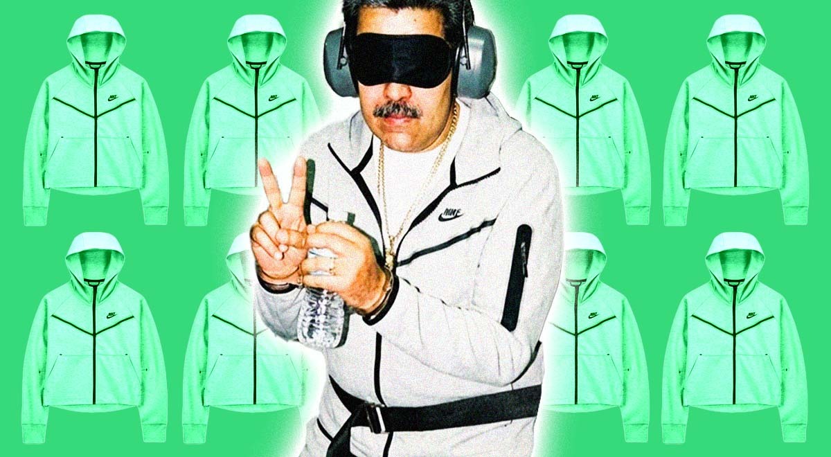 General Maduro in a grey Nike tracksuit and sleeping mask, doing the peace sign.