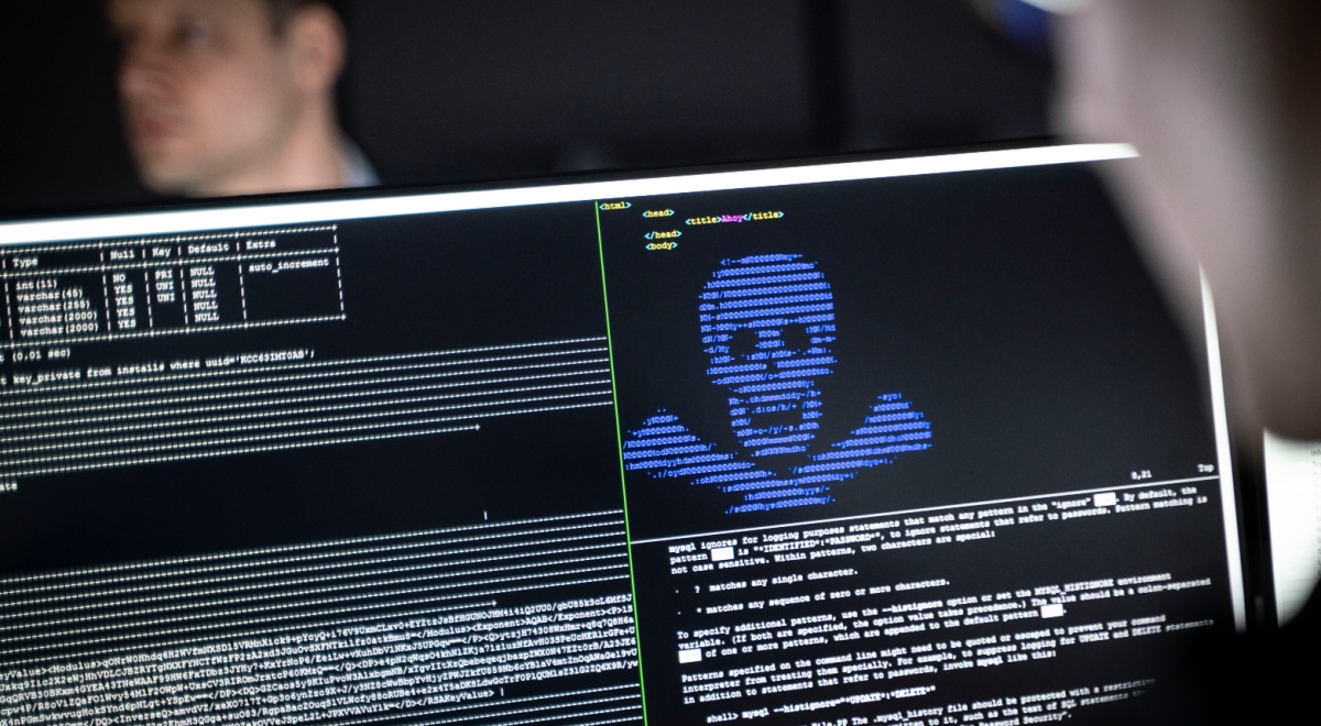 blurry man face in left top corner, black screen, white and blue letters, human scull
