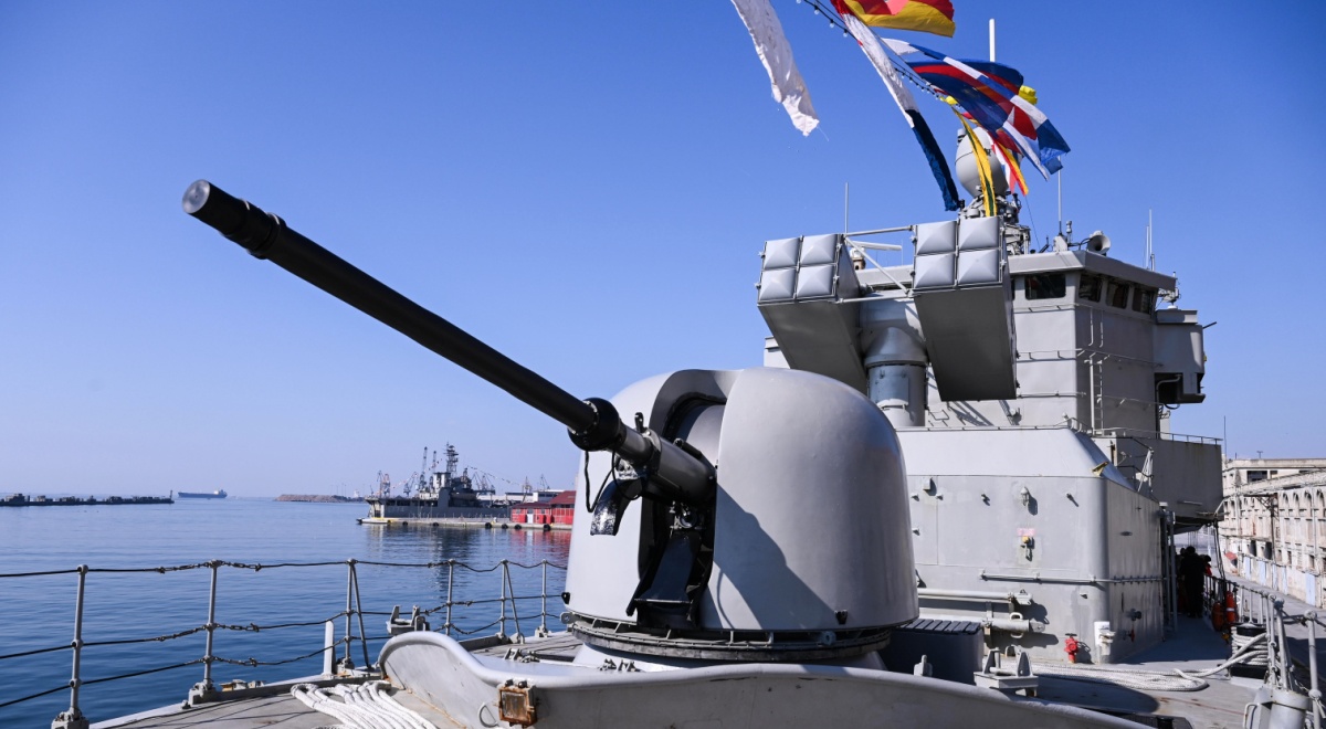 greece war ship, grey metal, flags, blue sky