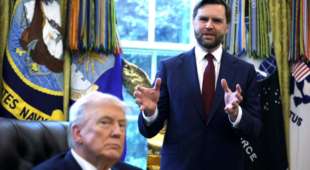 JD Vance gesticulating as Donald Trump looks on