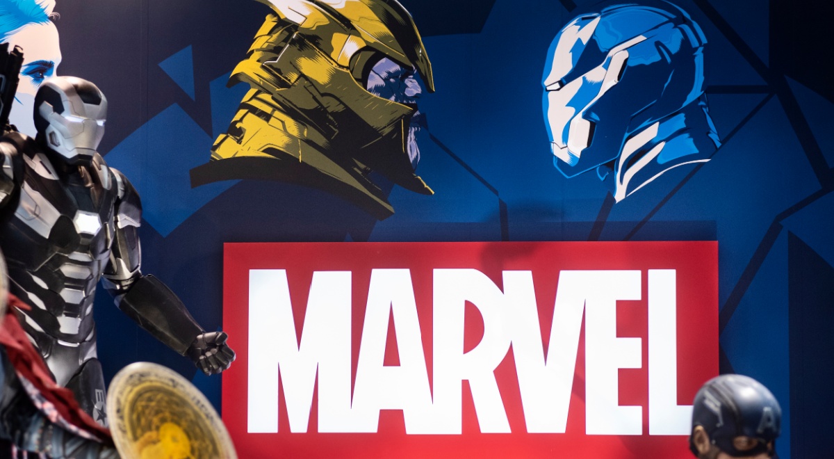 marvel logo, red background, white letter, yellow, blue helmet profiles, 