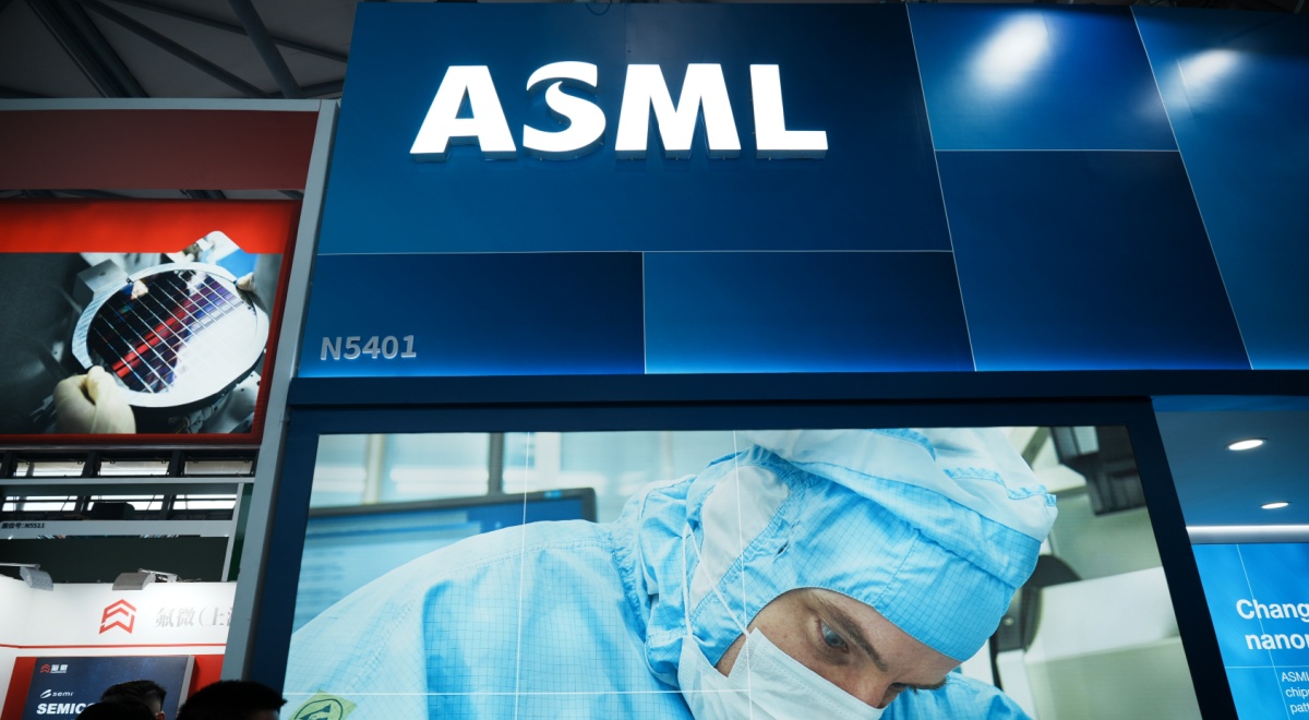 asml white letters shining above booth, doctor in light blue scrubs, face mask, 