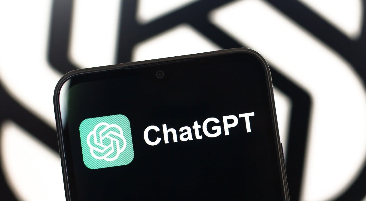 The ChatGPT logo is seen displayed on a smartphone screen.