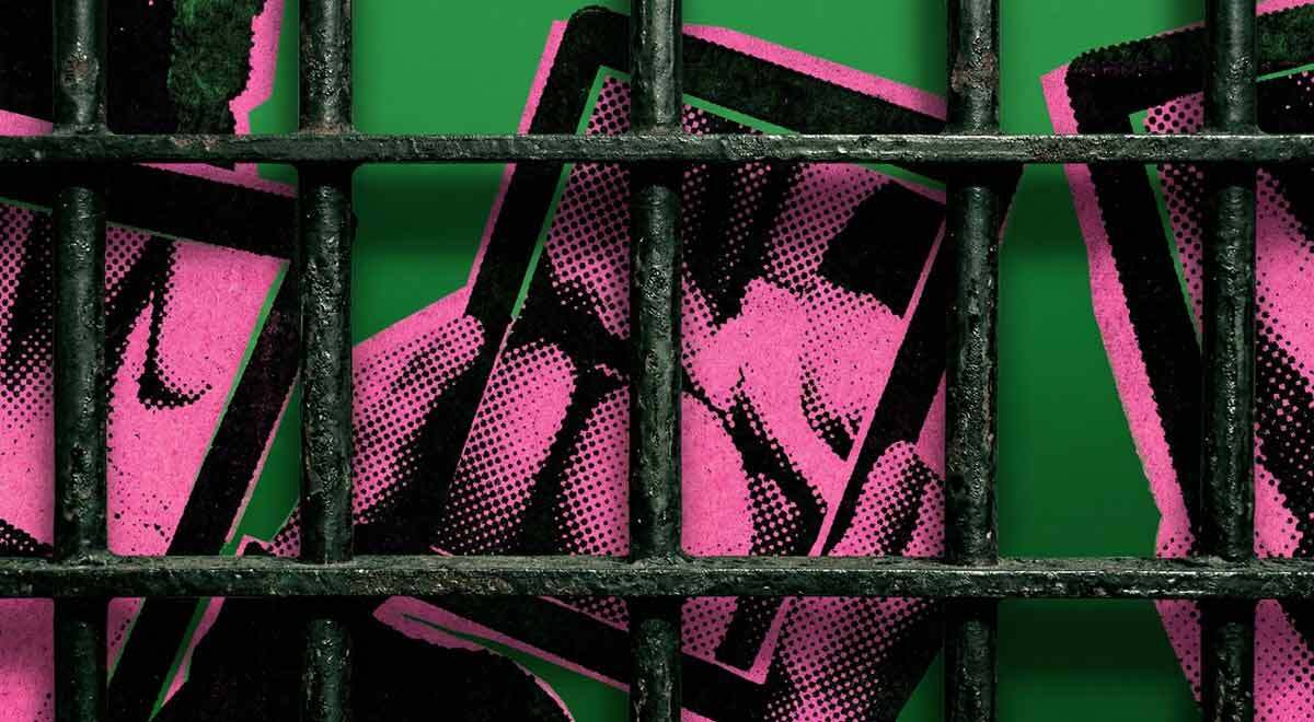Cell bars and hands holding a tablet with erotic content
