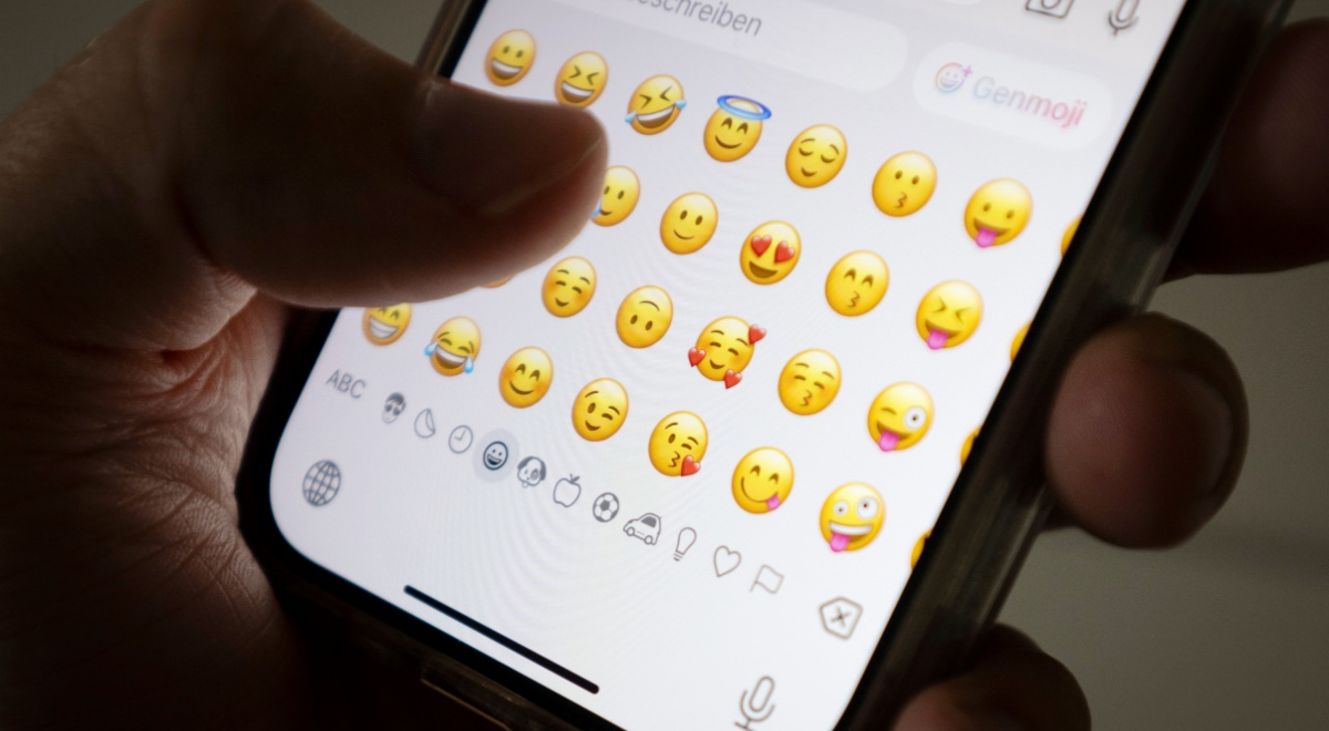 Person using emojis on the phone