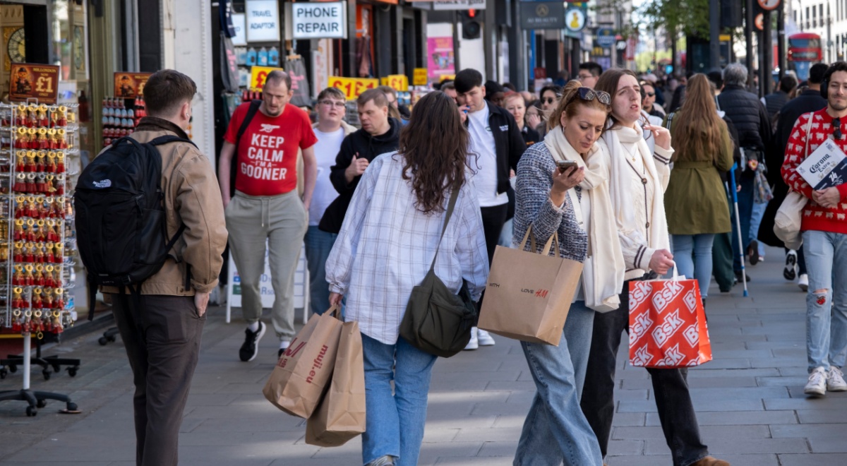busy london street, many people, brown, red shopping bags, jeans, blue jeans, red t-shirt