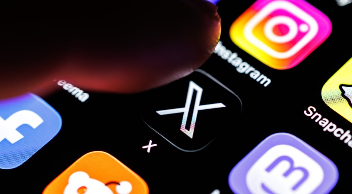 The logo of the X app (formerly Twitter) can be seen on the display of a smartphone in Munich