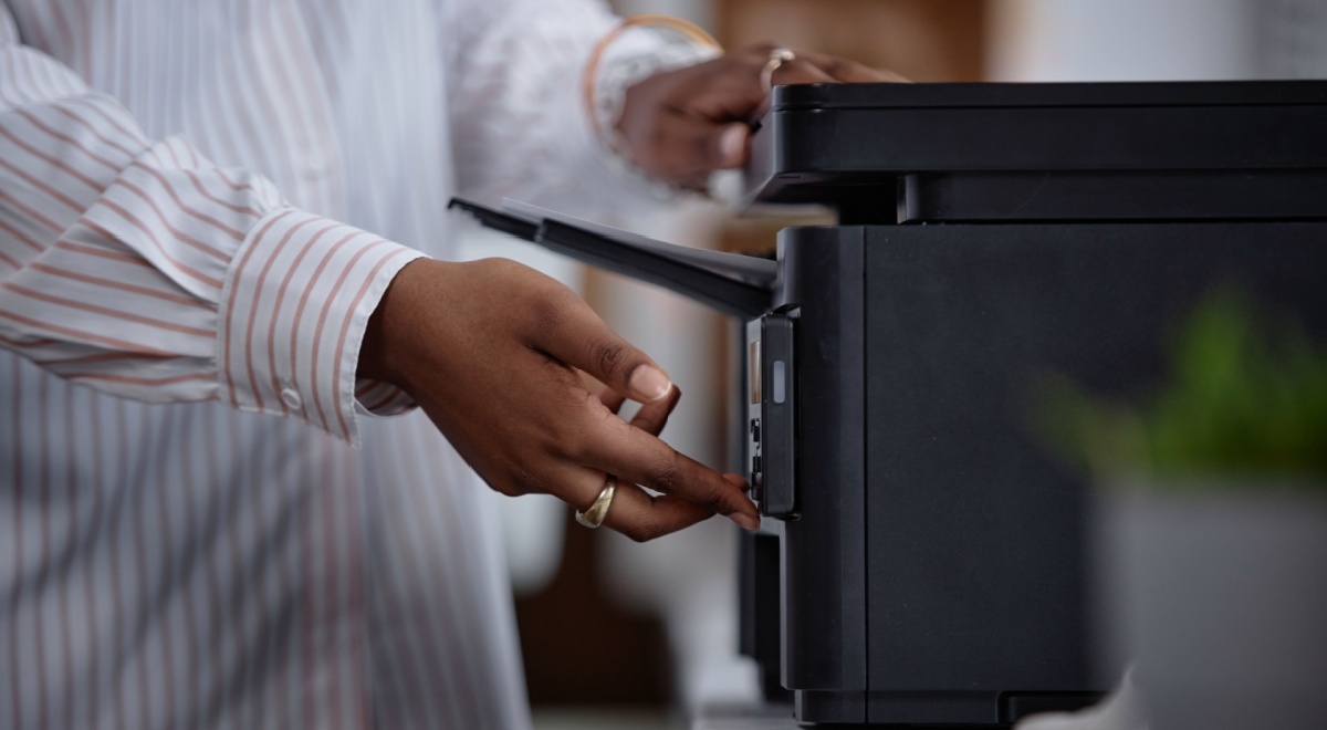 Woman using a black printer
