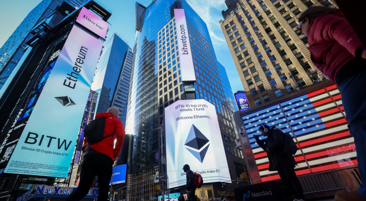 new york times square, ethereum signage, tall buildings, usa flag, people walking, clear blue sky