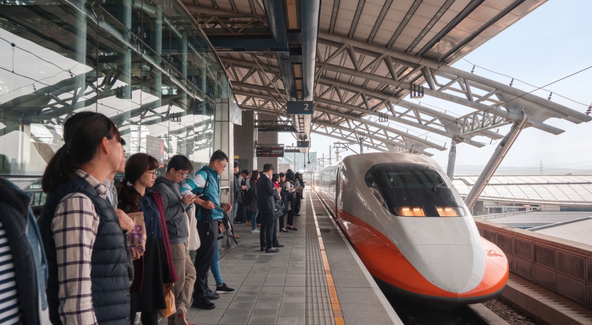 People waiting in a station for high-speed train