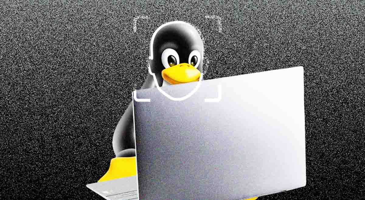 linux penguin, grey laptop, dark grey background