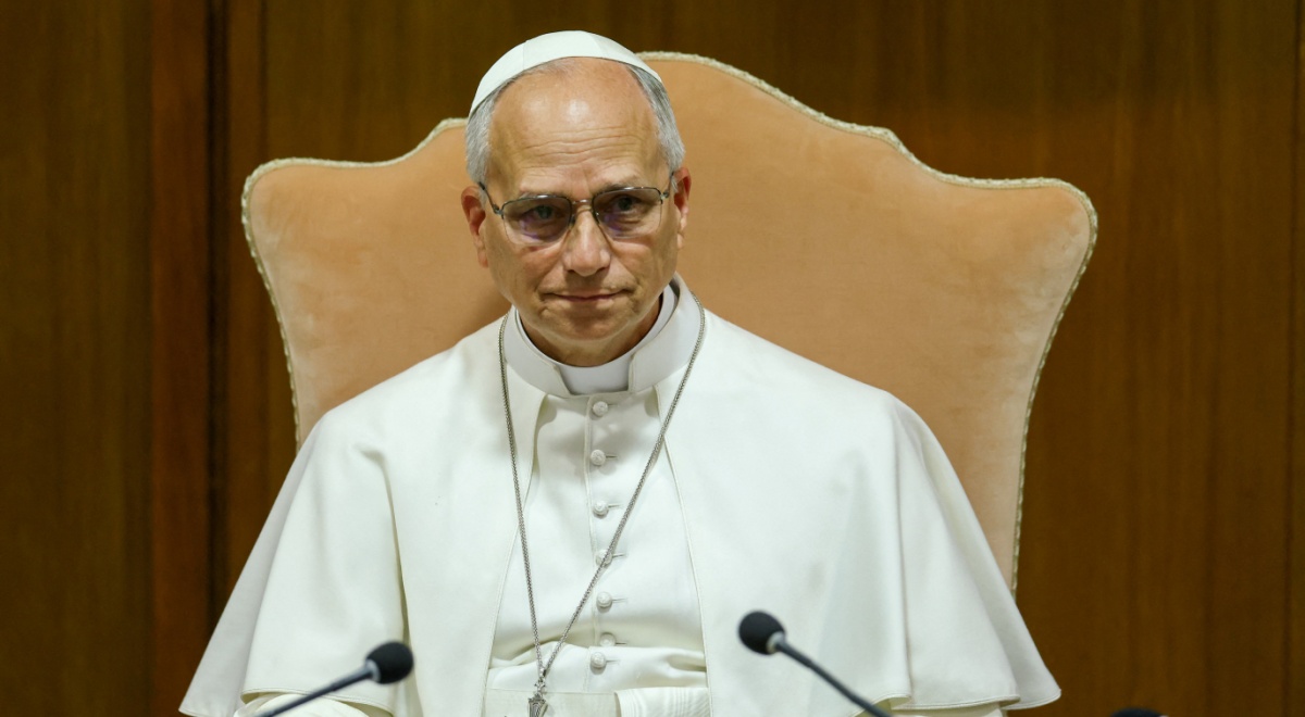 pope leo, sand color arm chair, white clothing, old man, glasses, two black microphones