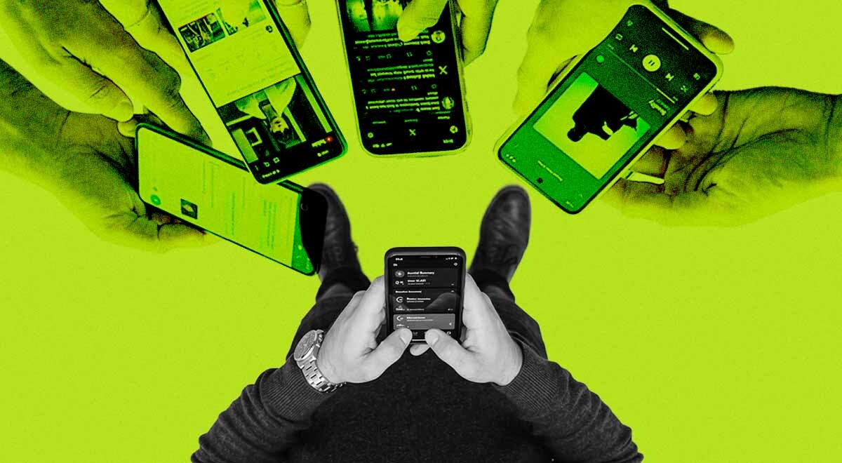 Person standing with a smartphone in hand