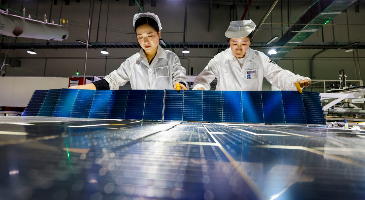 female chinese workers, dark blue solar panels, white laboratory outfits ,black hair, 