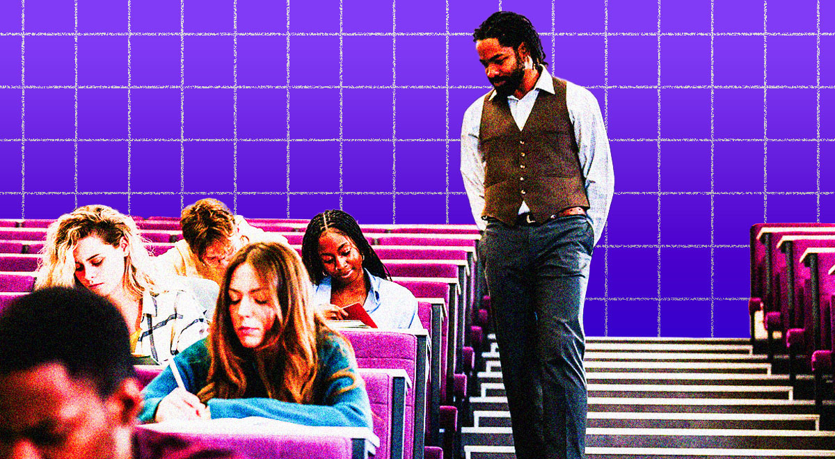 A professor walks in the classroom and observers students taking an exam