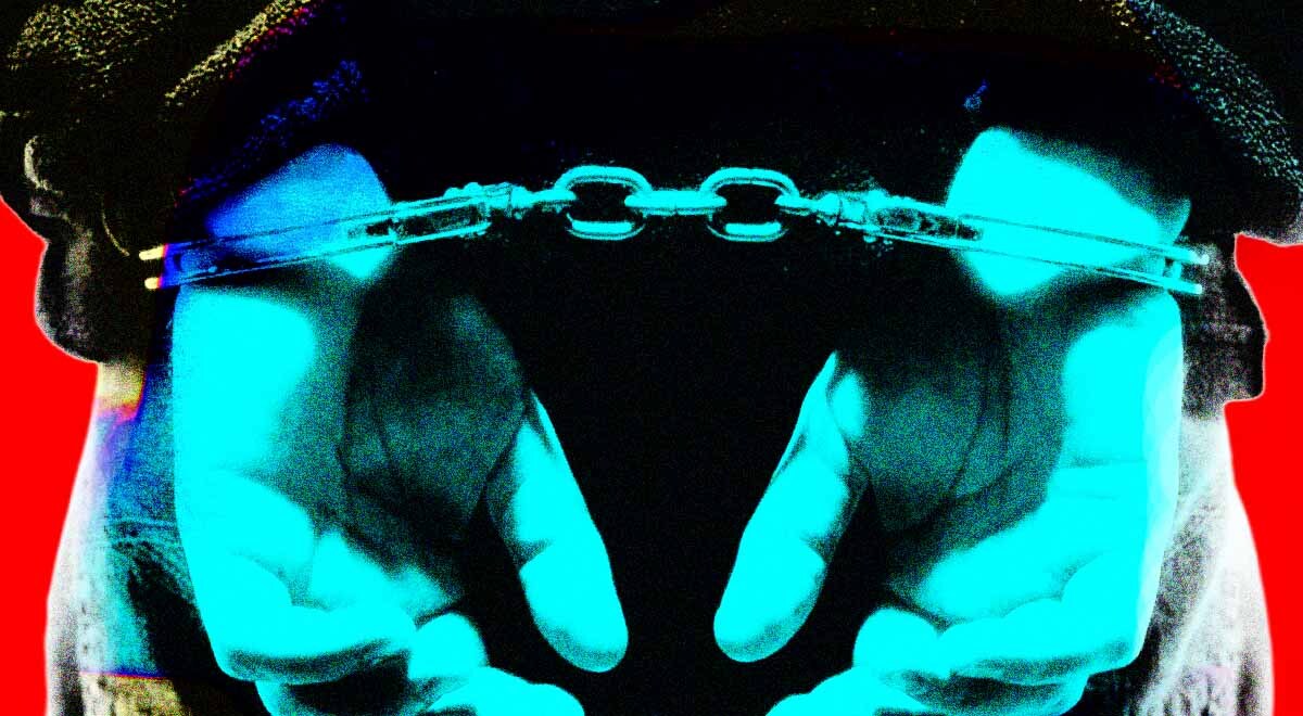 A person handcuffed behind their back