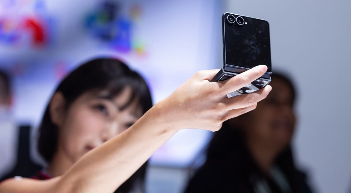 A person looks at a Samsung Galaxy Z Flip 8 smartphone
