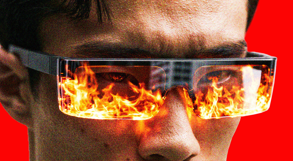 A person wearing smart glasses with flames reflecting on the lenses