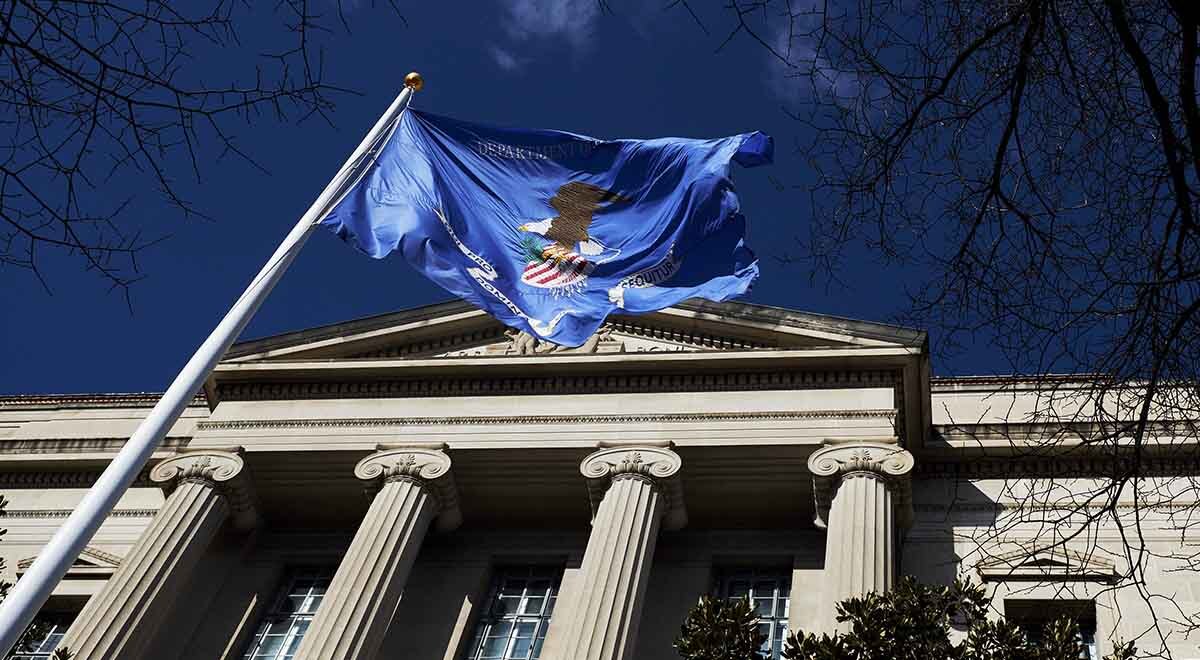 US department of justice building and flag