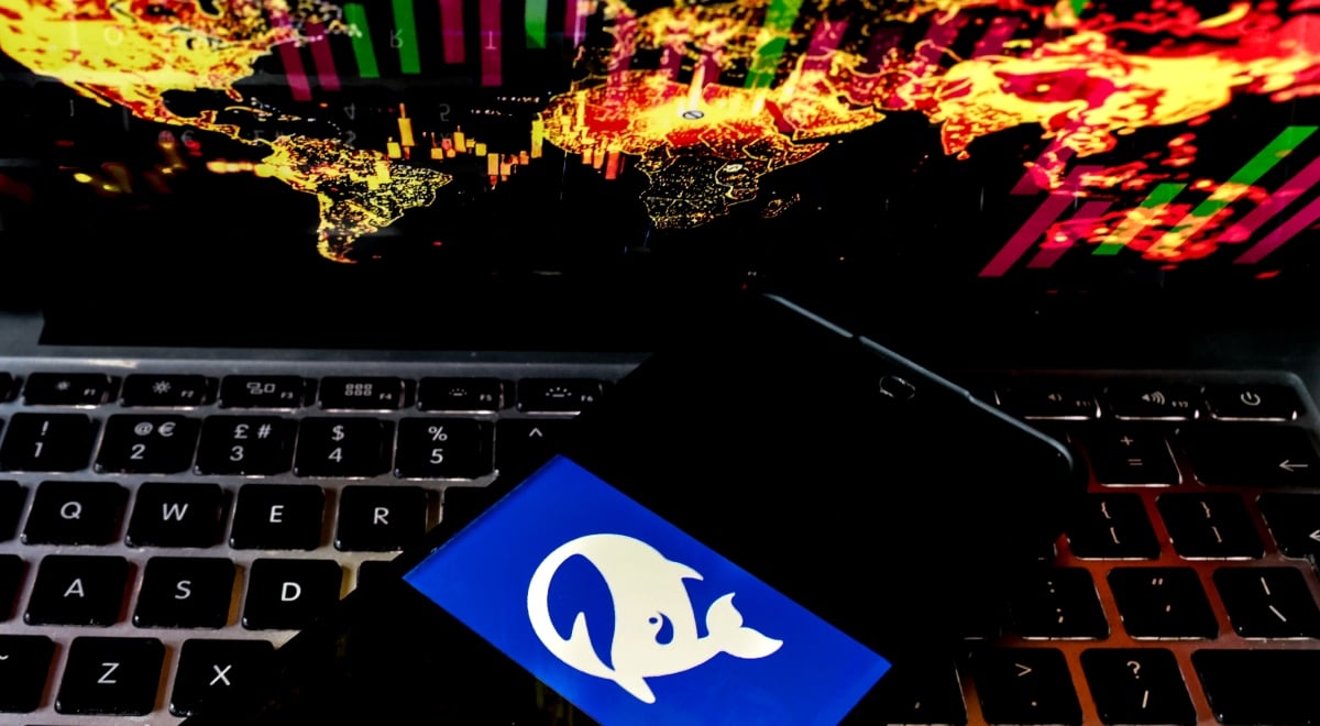 deepseek logo, white whale in blue background, black phone screen, black keyboard, world map