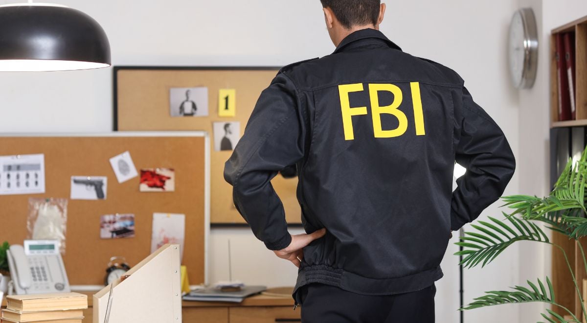 Male FBI agent in office, back view
