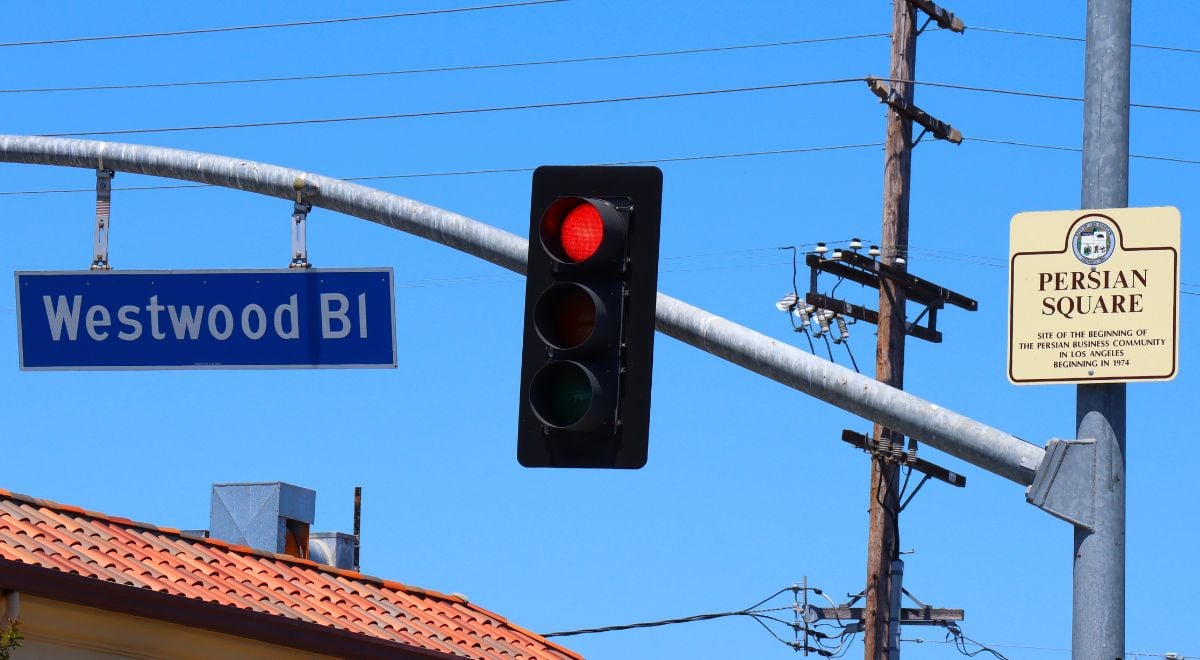 Persian Square and Westwood signs hanging from street light