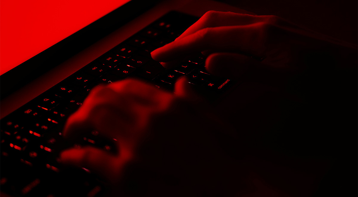 fingers on a laptop keyboard