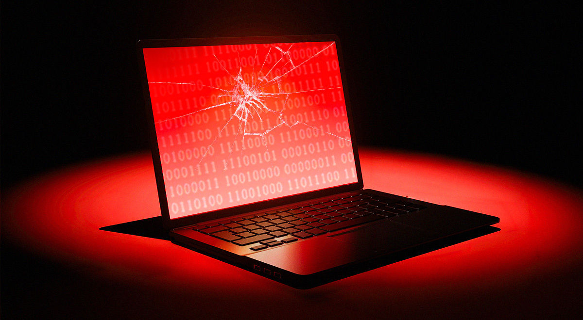laptop with a broken glass, red, black background