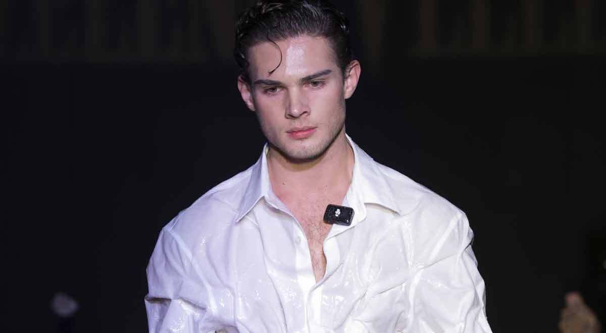 Looksmaxxer Clavicular on a dark runway.