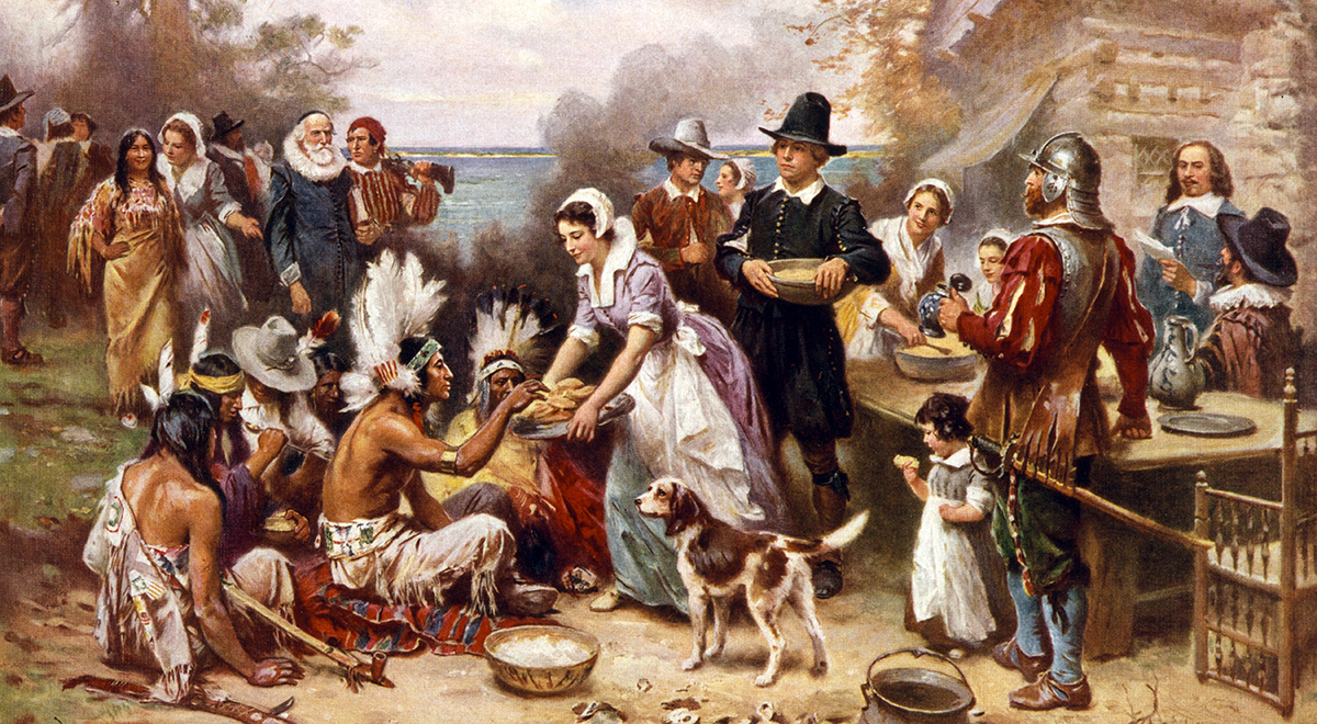 first thanksgiving 1621. Pilgrims and Natives gather to share meal