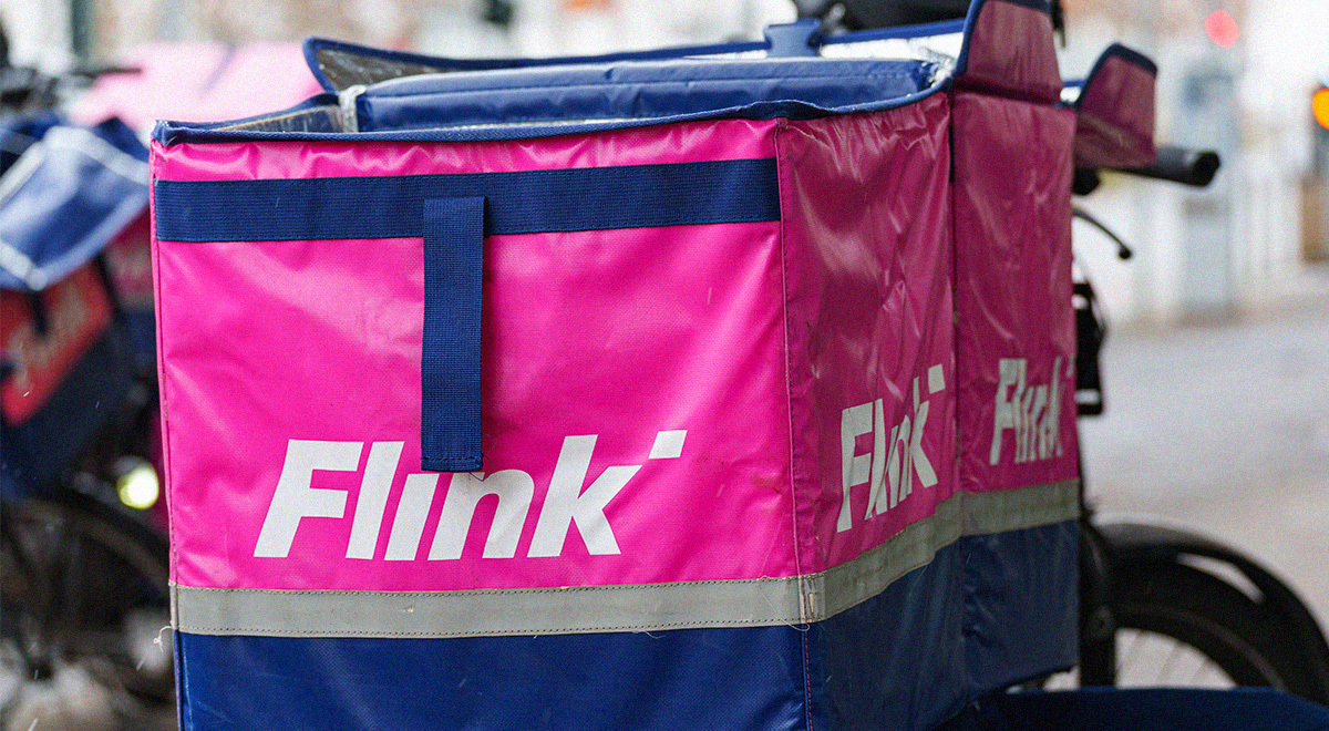 Flink bag with ompany logo visible, fixed on a bike