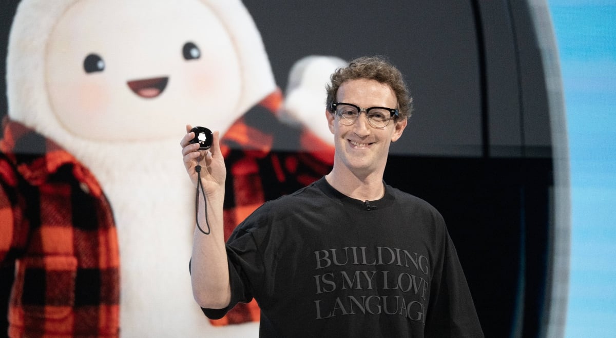 Meta CEO Mark Zuckerberg holding a Muse Charm device