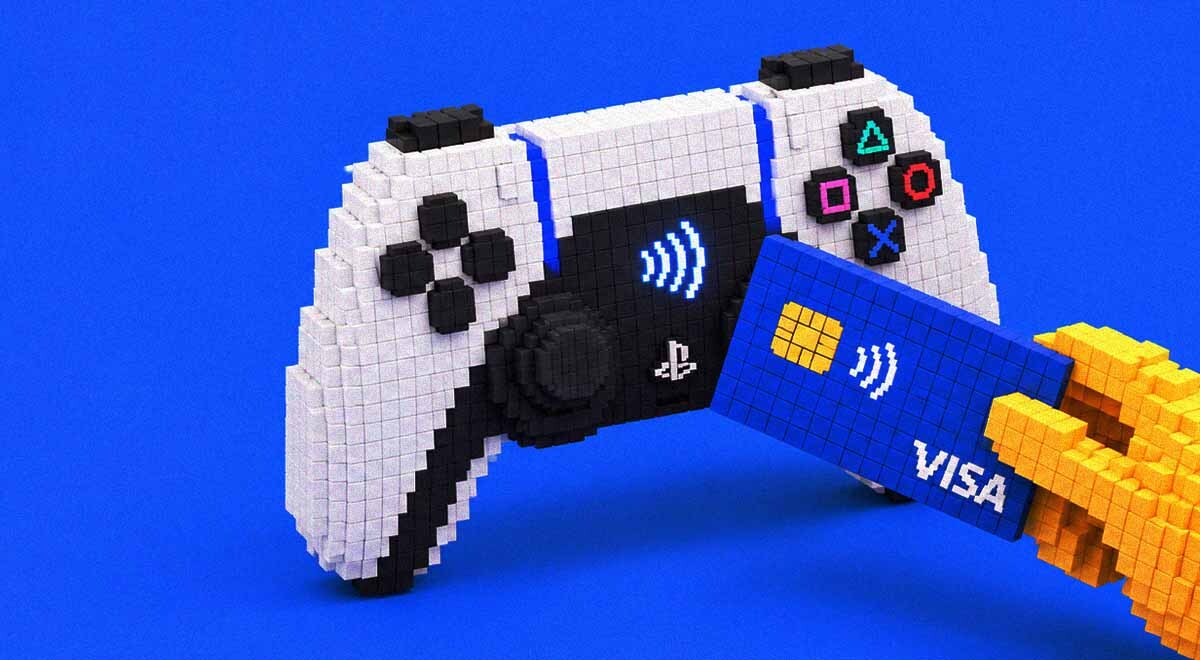 A hand making a card payment via PlayStation controller