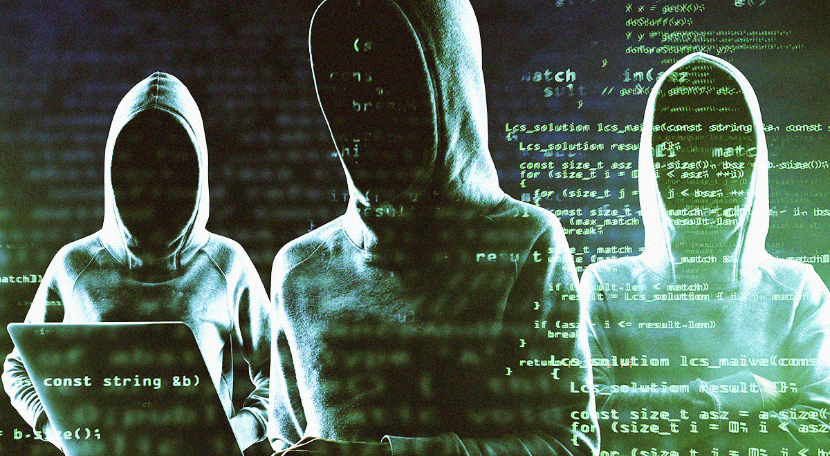 Three hackers in hoodies surrounded by the black background with snippets of green code.