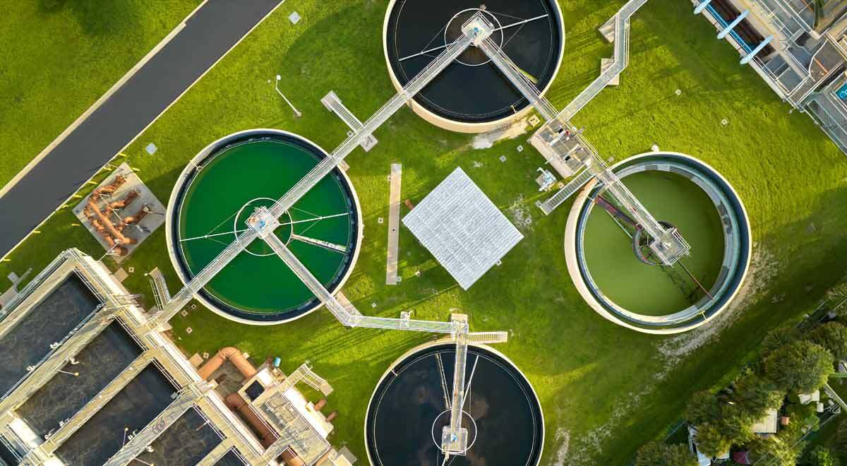 Water utility plants pictured from above, surrounded by greengrass