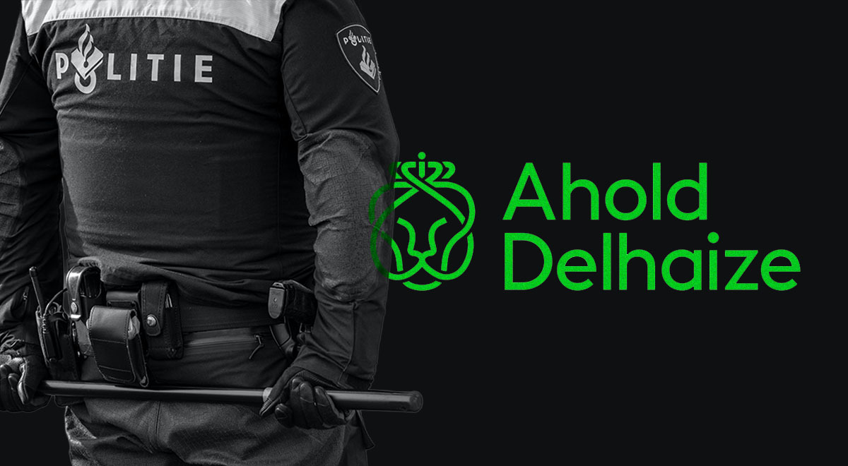 Ahold Delhaize and Dutch police officer holding a baton behind his back