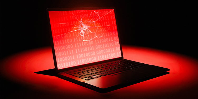 laptop with a broken glass, red, black background