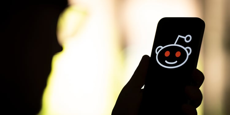 The Reddit logo is seen in this photo illustration