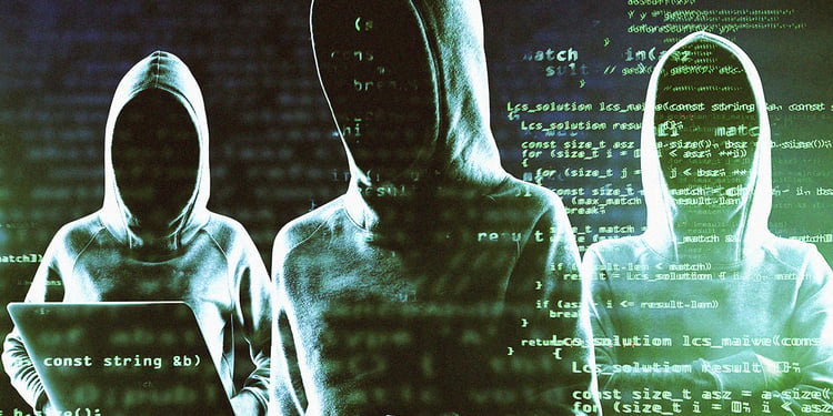 Three hackers in hoodies surrounded by the black background with snippets of green code.