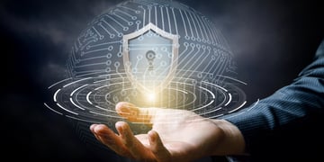 Hand showing the shield for protecting information systems.