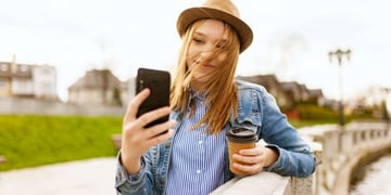 girl taking a photo with smartphone