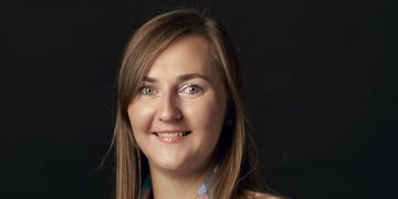 A portrait of a woman in a black background