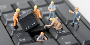 miniature people Work on Computer Keyboard