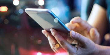 Woman holding mobile phone