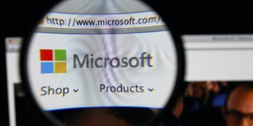 Microsoft logo through a magnifying glass