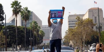 Man holding poster