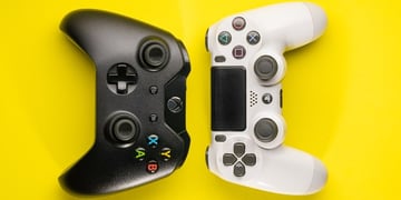 PS5 controller and Xbox controller put against each other