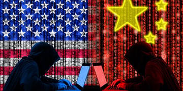 American hacker sitting opposite of a chinese hacker cyberwar concept in front of binary flags