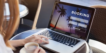 Woman booking a holiday on a laptop